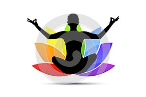 Young person sitting in yoga meditation lotus position silhouette with lily in rainbow colors