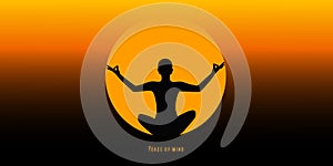 Young person sitting in yoga meditation lotus position silhouette at sunset