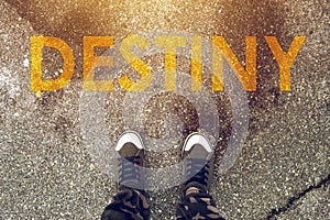 Young person standing on the road with Destiny imprint photo