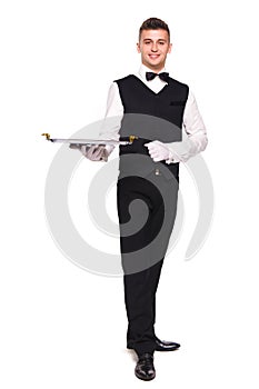 Young person in a suit holding an empty tray isolated on white b