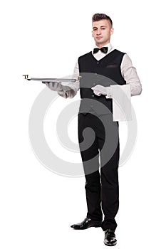 Young person in a suit holding an empty tray isolated on white b