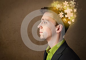 Young person thinking with glowing puzzle mind