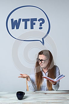 Young perturbed businesswoman looking away on