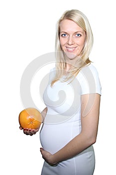 Young Petty Natual Beauty Pregnant Woman Holding Grapefruit and Shows a Belly That Begins to Grow Isolated on White Background.