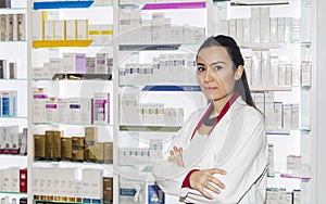 Young pharmacist woman in drug store