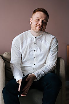 Young photogenic man posing with digital tablet in hands,