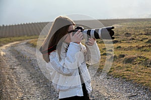 Young photographer girl taking first photos photo