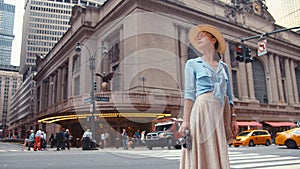 Young photographer with a retro camera at the Central Station