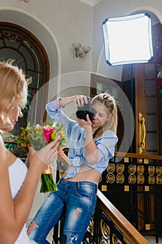 Young photographer is taking pictures the bride