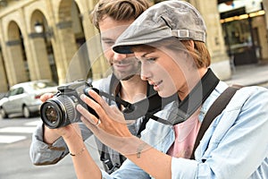 Young photographers doing photo reportage
