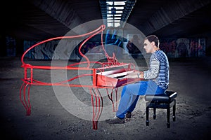 Young pianist play on his piano with bright emotions,