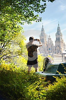 Young Pilgrim Taking Photo Of Church In Santiago De Compostela