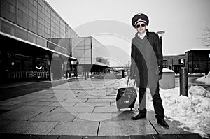 Young pilot with baggage in Kastrup airport