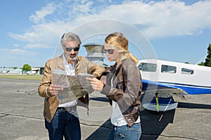 Young pilot and beautiful stewardess together