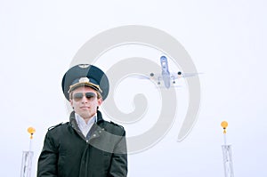 Young pilot with glasses and black coat