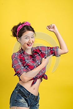 Young pin-up asian woman like classic We Can Do It poster over y