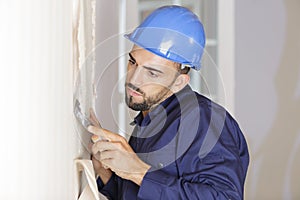 Young plasterer at work