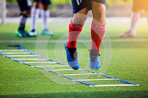 Young player exercises on ladder drills.