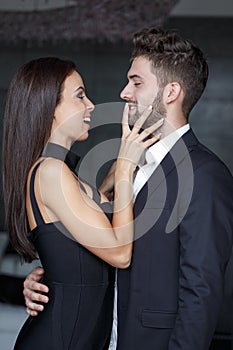 Young playful couple in happiness and fun indoors