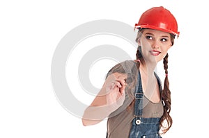 Young playful worker woman in coverall and helmet