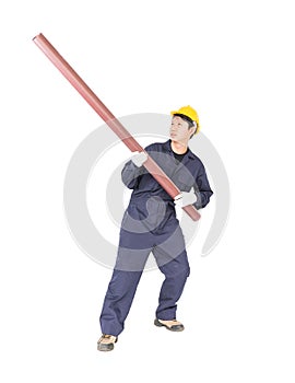 Young plumber holding pvc pipe