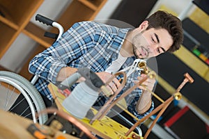 young plumber worker in wheelchair