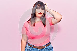 Young plus size woman wearing casual clothes confuse and wonder about question