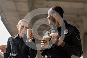 young police officers having coffee break