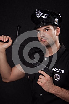 Young policeman with guns