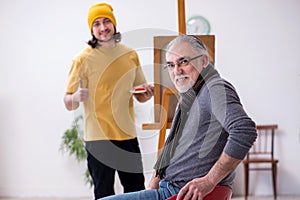 Young portraitist and old male model