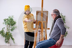 Young portraitist and old male model