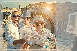 Young positive famly take a vacation photo on the Side ampitheatre view