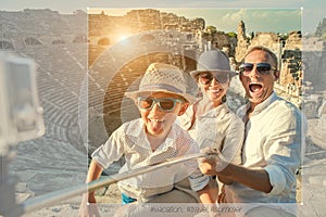 Young positive famly take a vacation photo on the Side ampitheatre view