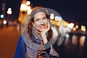 Young positive hungarian urban woman toothy smiling at night Budapest