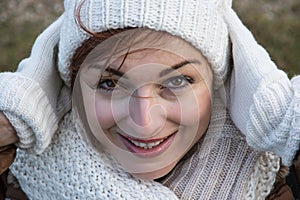 Young positive woman with white cap and gloves