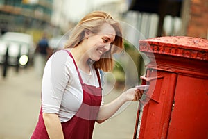 A young  posting her letter