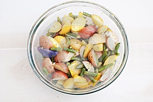 Young potato salad with green beans top view from