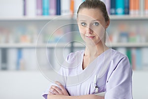 Young practitioner posing in the office