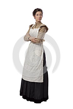 Young prairie woman wearing apron with arms folded isolated on white background