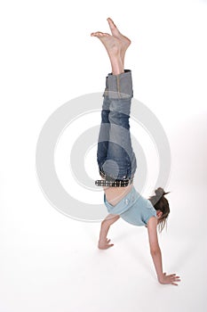 Young Pre Teen Girl Performing A Handstand 1