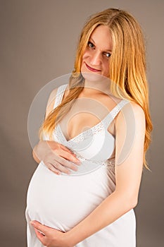 Young pregnant attractive blonde