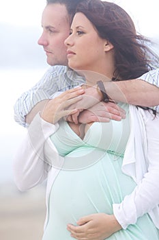 Young Pregnant Couple In Love