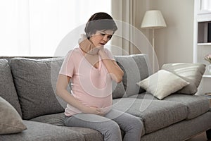 Pregnant female wear orthopedic brace suffer of neck pain osteochondrosis