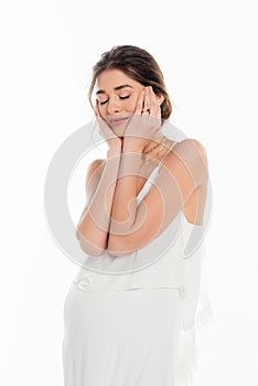 young, pregnant fiancee touching face while