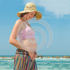 Young Pregnant Woman in the Beach