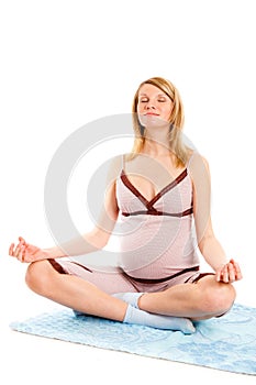 Young pregnant woman doing exercises