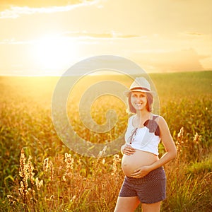 Young Pregnant Woman Embracing Her Belly