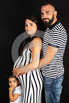 Young pregnant woman with her family father daughter and mother pregnancy