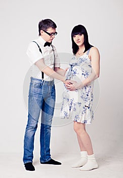 Young pregnant woman with her husband