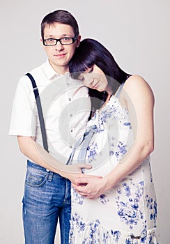 Young pregnant woman with her husband